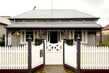 Victorian picket fence with inset wooden gate